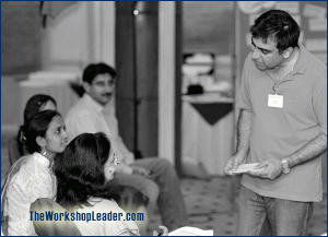 Leading by asking - either the group or single participants directly. 