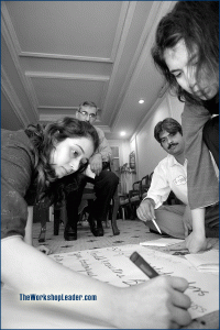 Participants in concentrated group work during a workshop